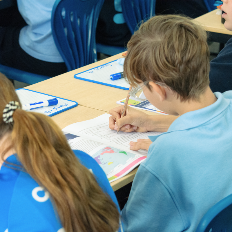 An image of a student doing literacy activities in the Humanities program Oxford Connections: People & Places